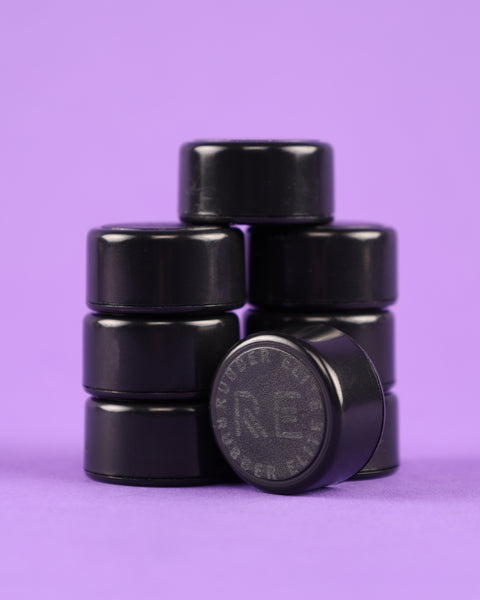 Group of Elite Rubber Monogramed Locking Cap for Rubber Restraints